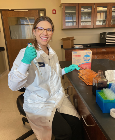 Scientist learning to pipette