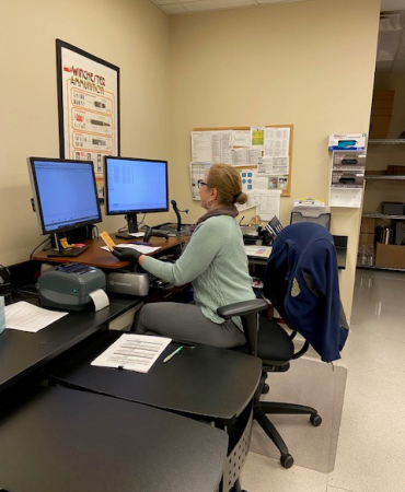 Technician working evidence received in evidence receiving unit