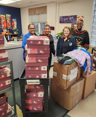 Forensic Services team with donated winter coats