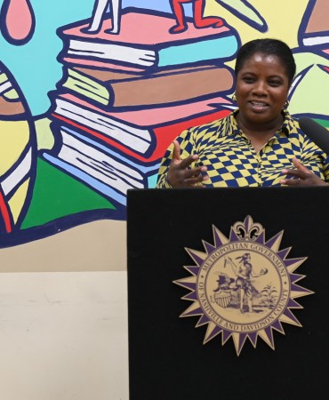 Woman standing at podium at Participatory Budgeting celebration