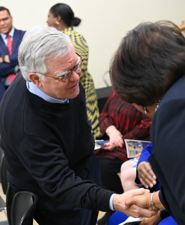 Mayor Cooper shaking hands at Participatory Budgeting Celebration