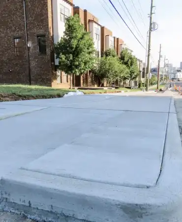 New bus boarding island and repaired sidewalk across from Archer Street