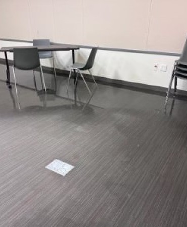 standing water on floor in conference room at Lentz Public Health Center