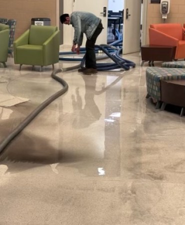 crews cleaning up water damage at Lentz Public Health Center
