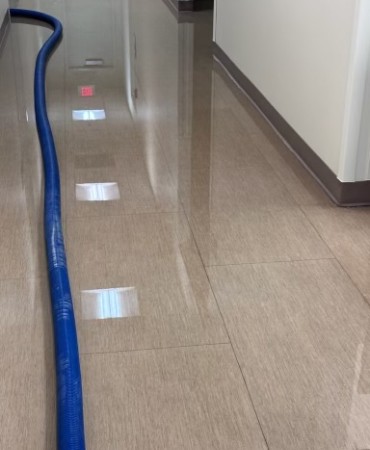 standing water on floor in hallway at Lentz Public Health Center