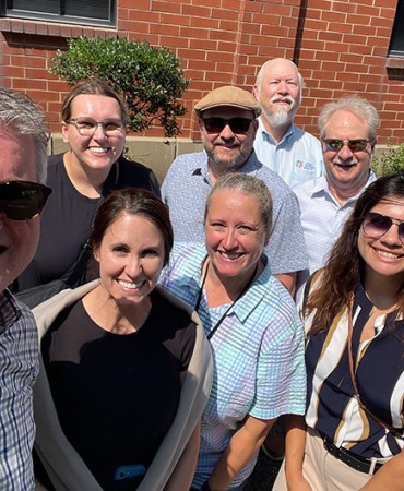 group of students standing in a parking lot