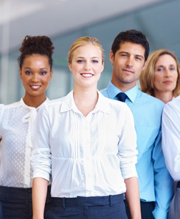 group of office workers standing next to each other
