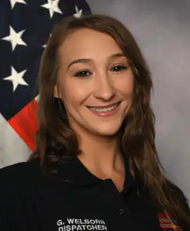 woman in front of American flag 