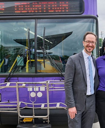 Mayor Freddie O'Connell stands with WeGo employee in front of a WeGo bus