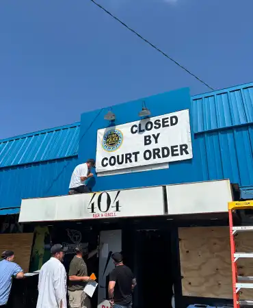Closed by Court Order sign above 404 Bar