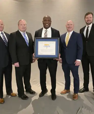 MNPD receives Advanced Law Enforcement Reaccreditation with Excellence.  (L-R) CALEA President Matthew Packard, Colonel, Colorado State Patrol, MNPD Lieutenant Jason Sharpe, MNPD Sergeant Michael Park, Chief Drake, MNPD Accreditation Manager Lieutenant Matt Howlett, MNPD Sergeant Danny Cole, CALEA Executive Director W. Craig Hartley, Jr.