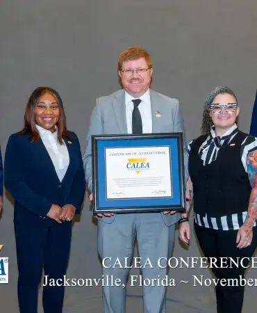 group stands with award