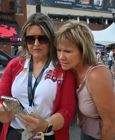 Women look at a cell phone