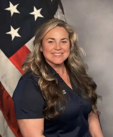 woman in front of flag