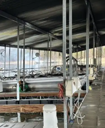 fire damaged boats at marina