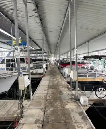 marina dock with boats on both sides