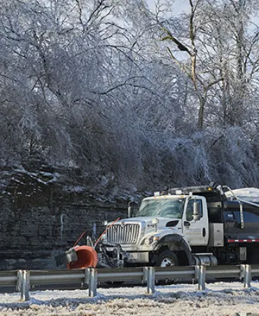 Snow plow in winter landscape